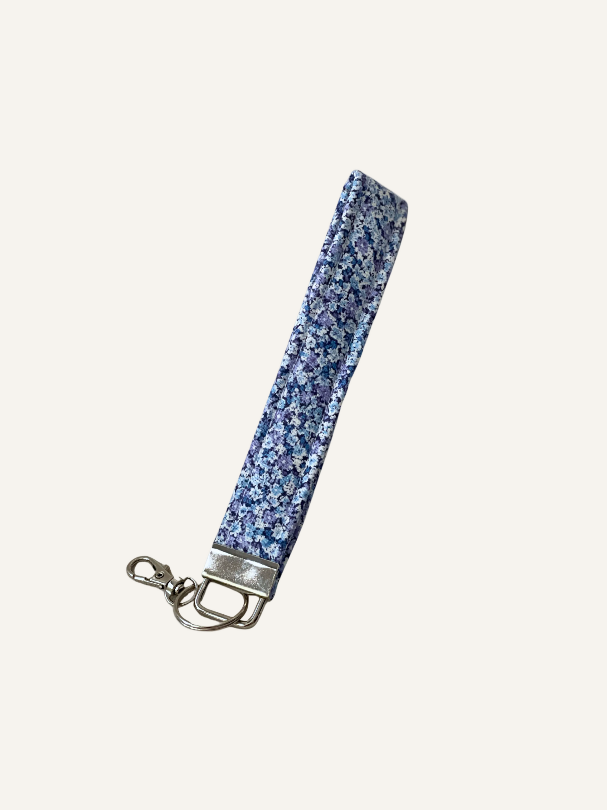 a padded fabric keyring wristlet in a classic ditsy blue floral print